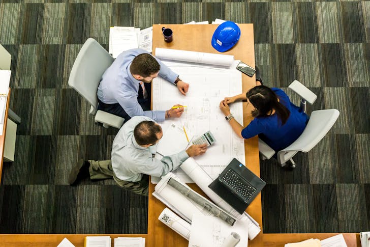 Construction loan rates - Construction team creating plans.